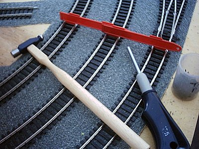 Track laying accessories: hammer, track guage, nails
